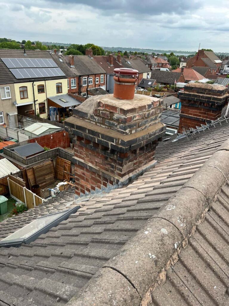 This is a photo taken from a roof which is being repaired by Kirkby in Ashfield Roofing Repairs, it shows a street of houses, and their roofs